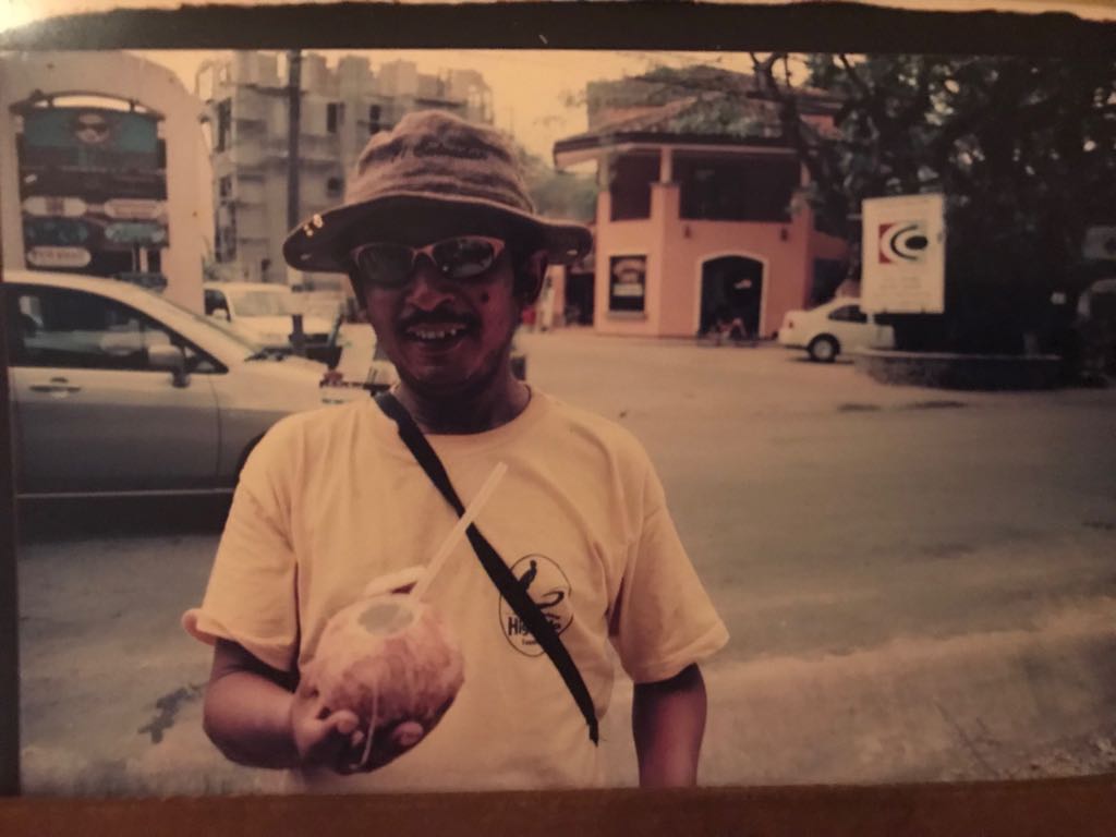 Vendor selling agua de Pipa (coconut water) in Tamarindo in the 1980's